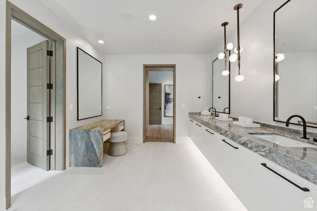 Bathroom featuring dual vanity and tile patterned flooring