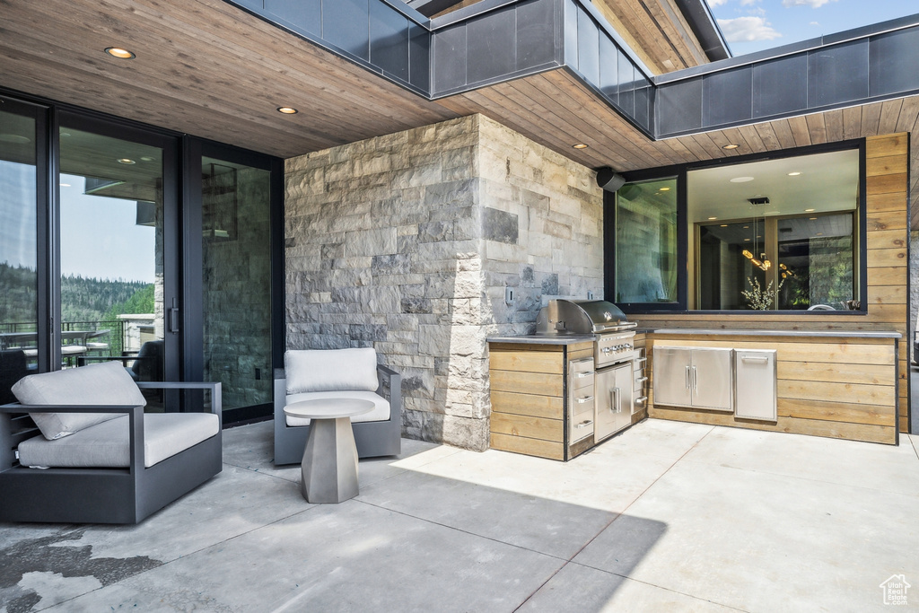 View of patio / terrace with grilling area and an outdoor kitchen