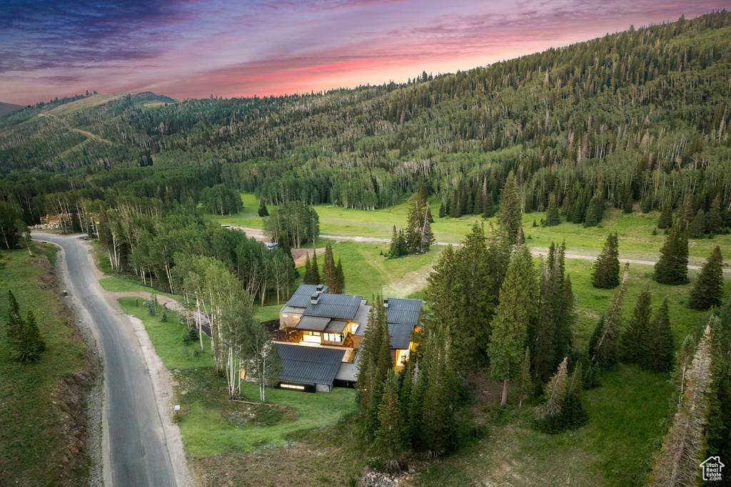 Aerial view at dusk featuring a rural view