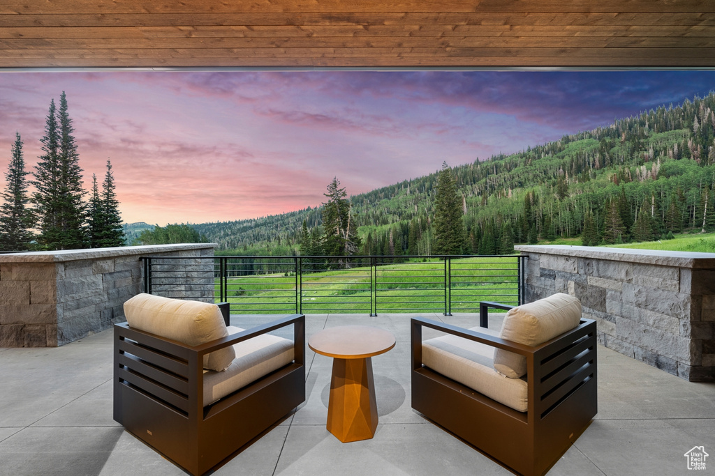 Patio terrace at dusk with outdoor lounge area