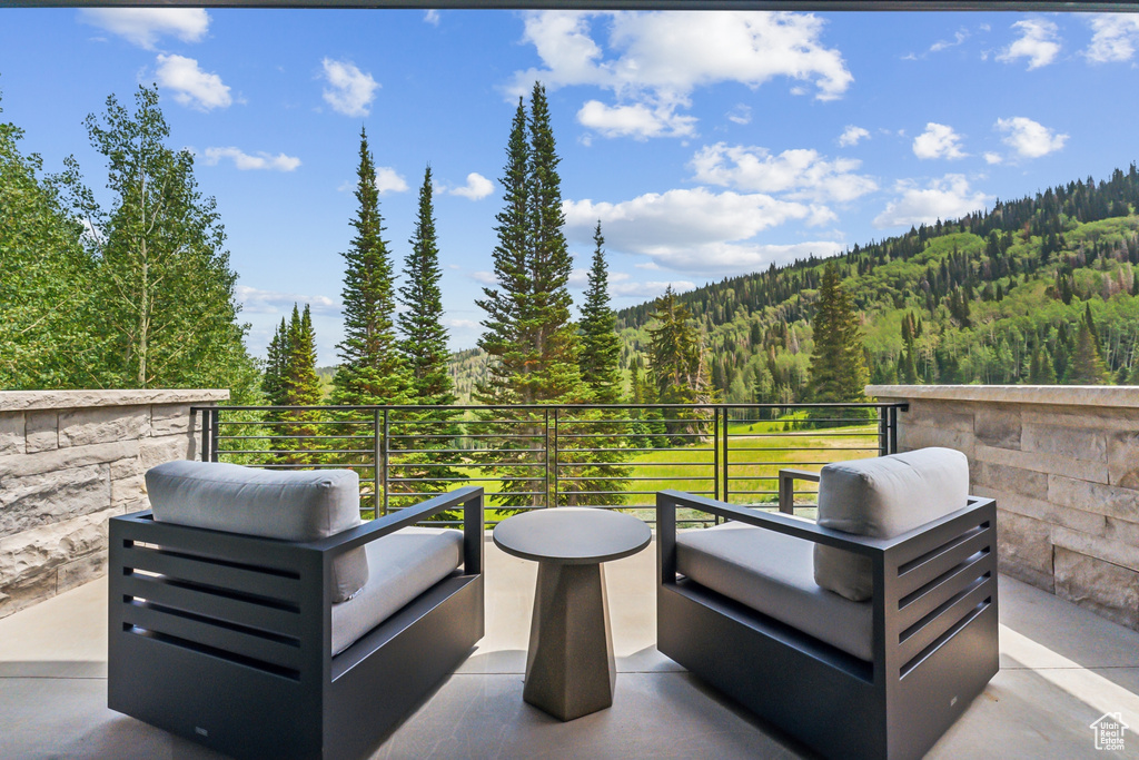 View of patio featuring a balcony and outdoor lounge area