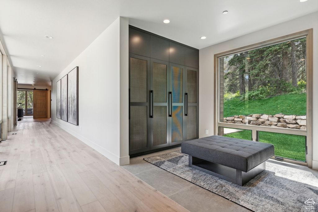 Interior space featuring a barn door and light hardwood / wood-style floors