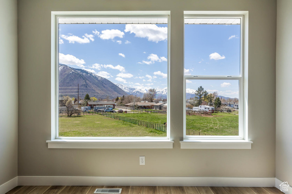 Details with a mountain view and hardwood / wood-style flooring