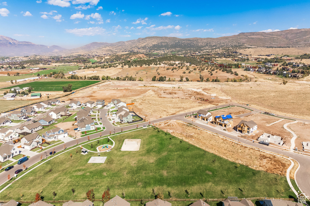 Birds eye view of property with a mountain view