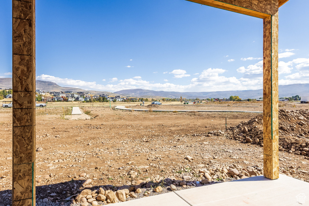 View of yard featuring a rural view and a mountain view