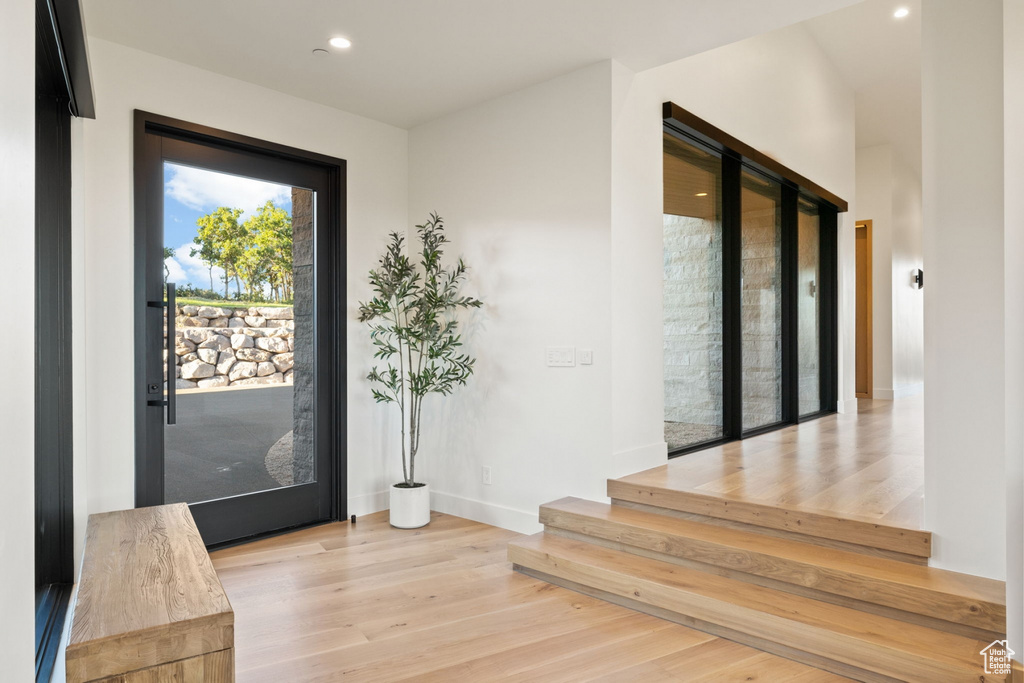 Doorway to outside featuring light hardwood / wood-style flooring