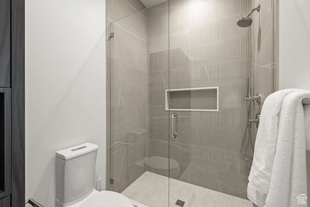 Bathroom with toilet and an enclosed shower