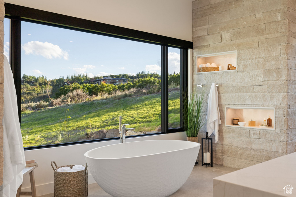 Bathroom with a tub to relax in