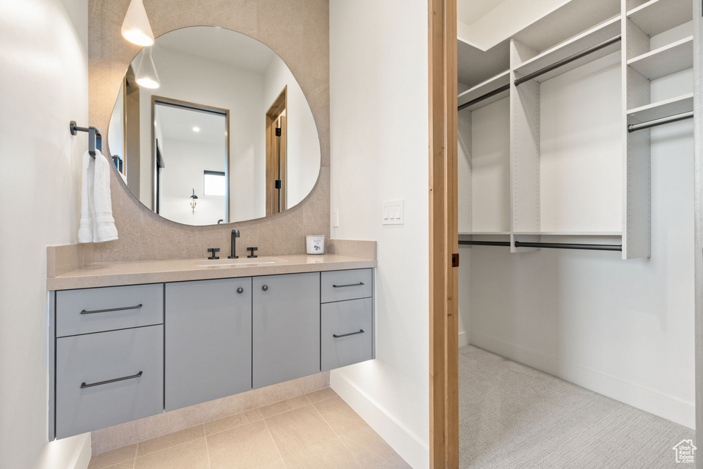 Bathroom with vanity and tile patterned floors