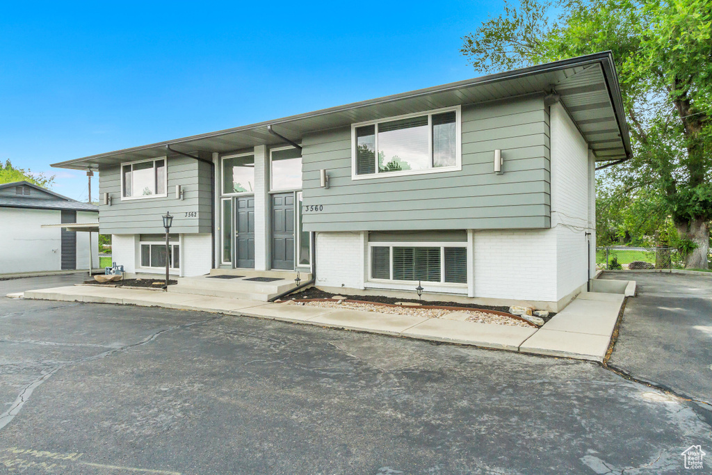 Rear view of property with a garage