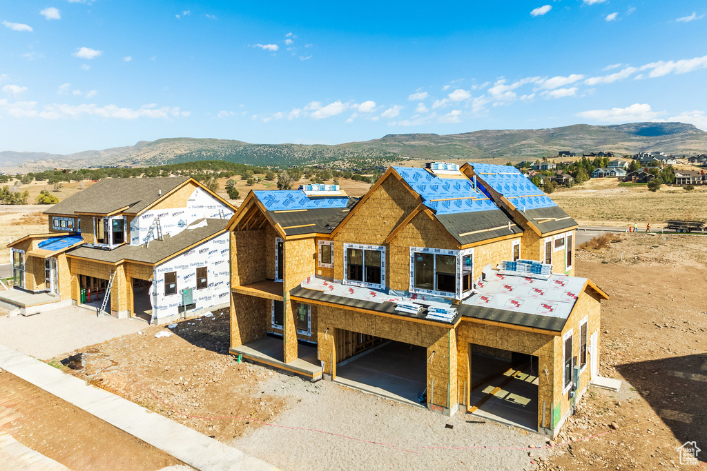 Property under construction with a mountain view