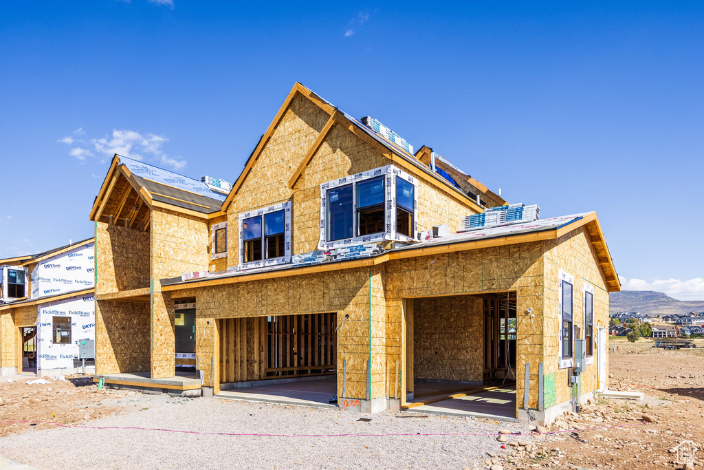 Property in mid-construction with a mountain view