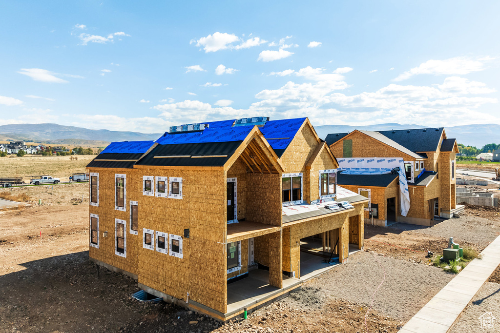 Exterior space featuring a mountain view