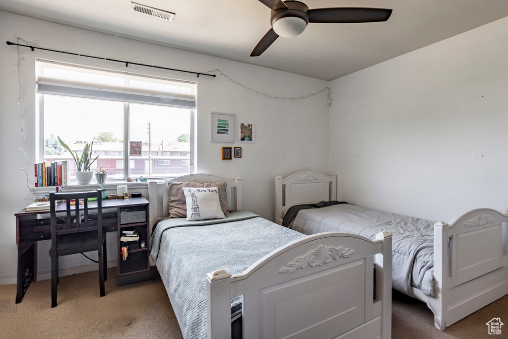 Bedroom with carpet flooring and ceiling fan