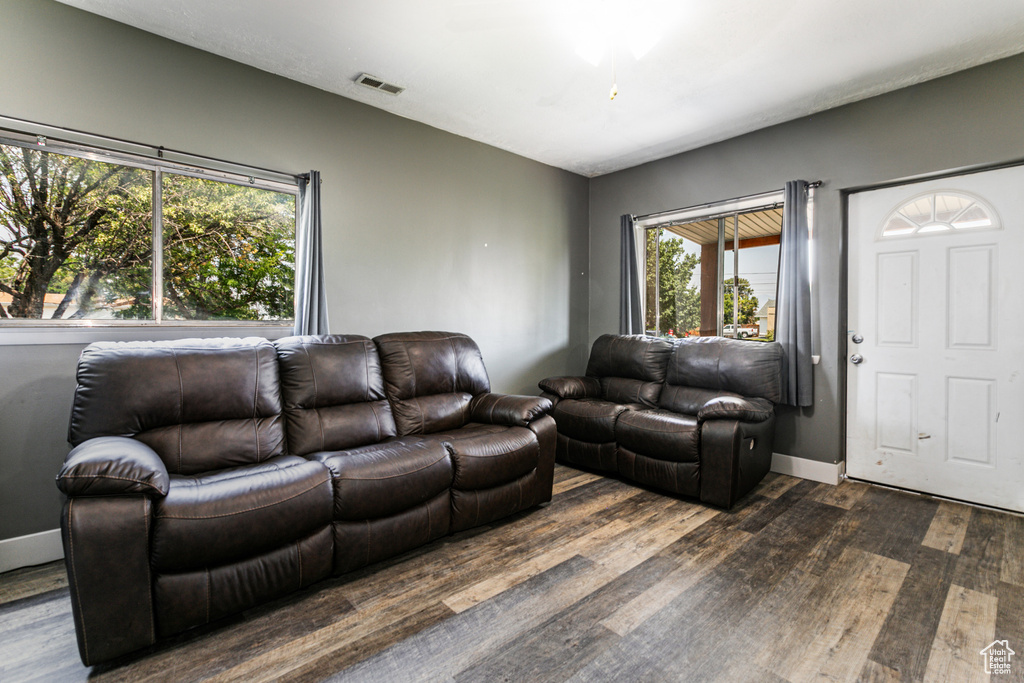 Living room with hardwood / wood-style flooring