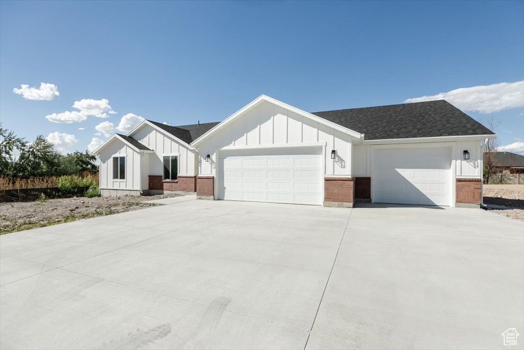 View of front facade featuring a garage