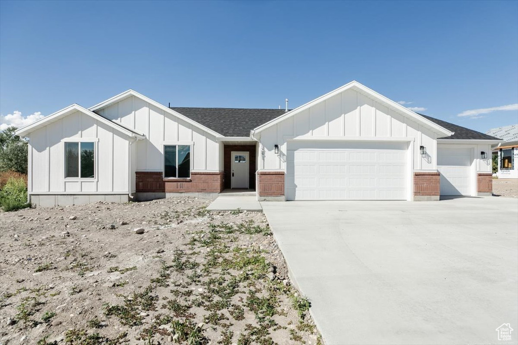 Modern farmhouse style home with a garage