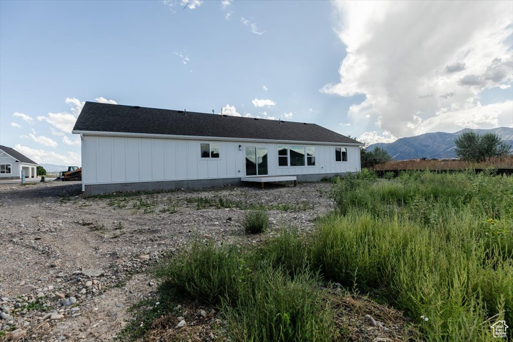 Back of house with a mountain view