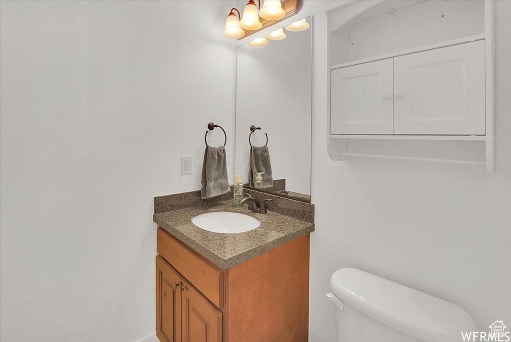 Bathroom featuring toilet and vanity