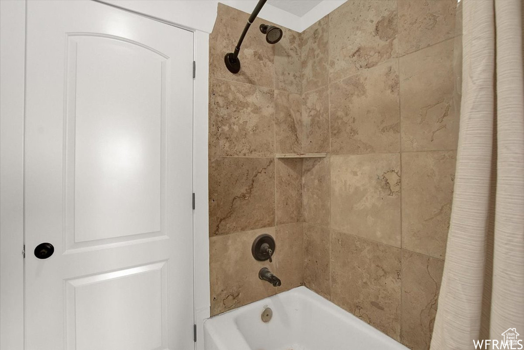 Bathroom with shower / tub combo with curtain