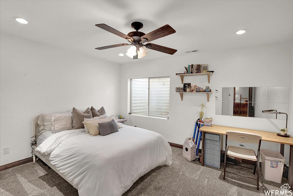 Bedroom featuring ceiling fan and carpet flooring