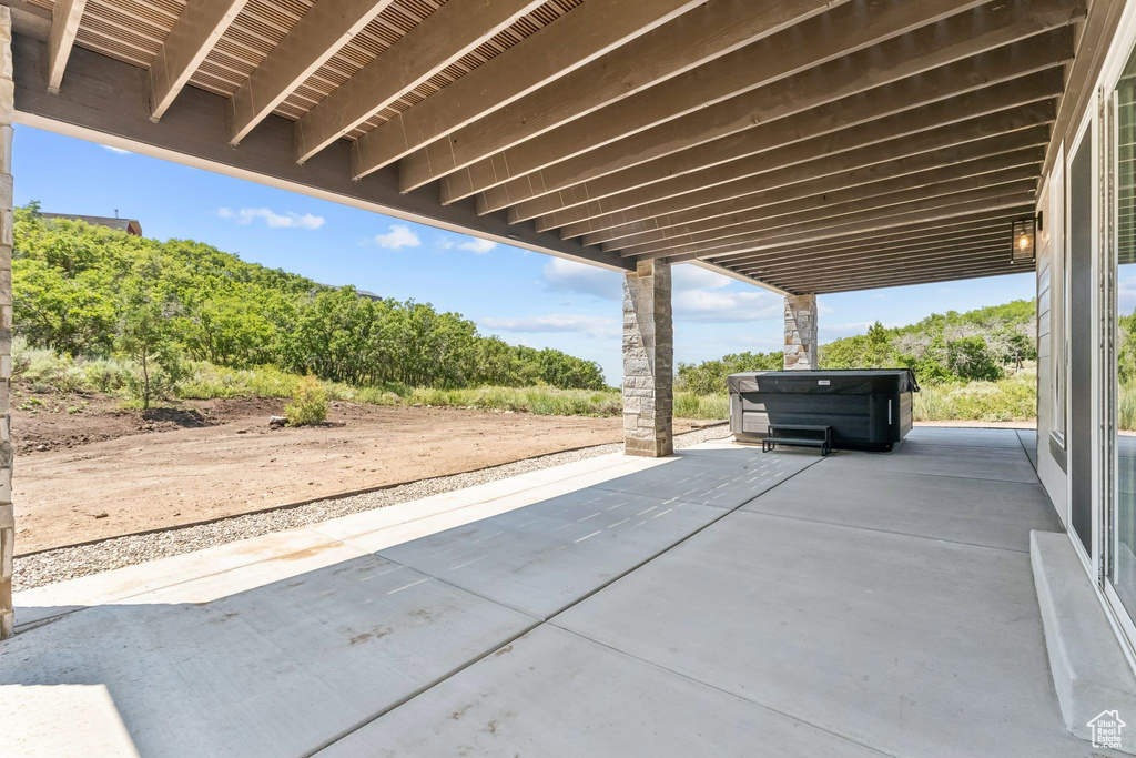 View of patio / terrace featuring a hot tub