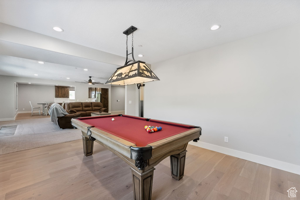 Playroom featuring light wood-type flooring, ceiling fan, and billiards