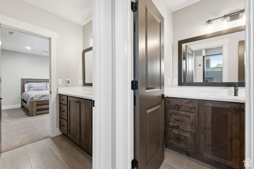 Bathroom with vanity and tile patterned floors