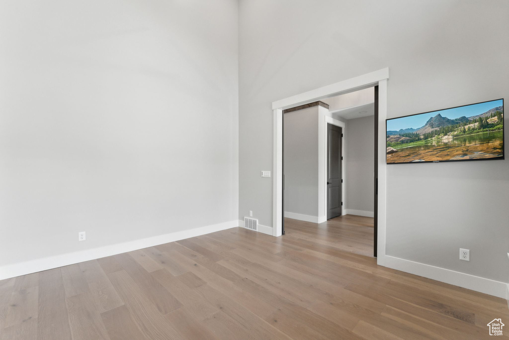 Unfurnished room with light hardwood / wood-style floors