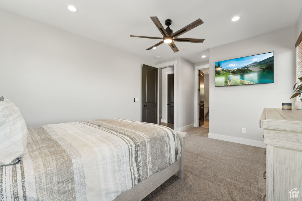 Carpeted bedroom with ceiling fan