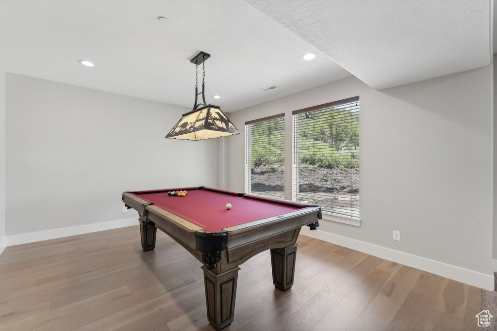 Recreation room featuring light hardwood / wood-style floors and billiards