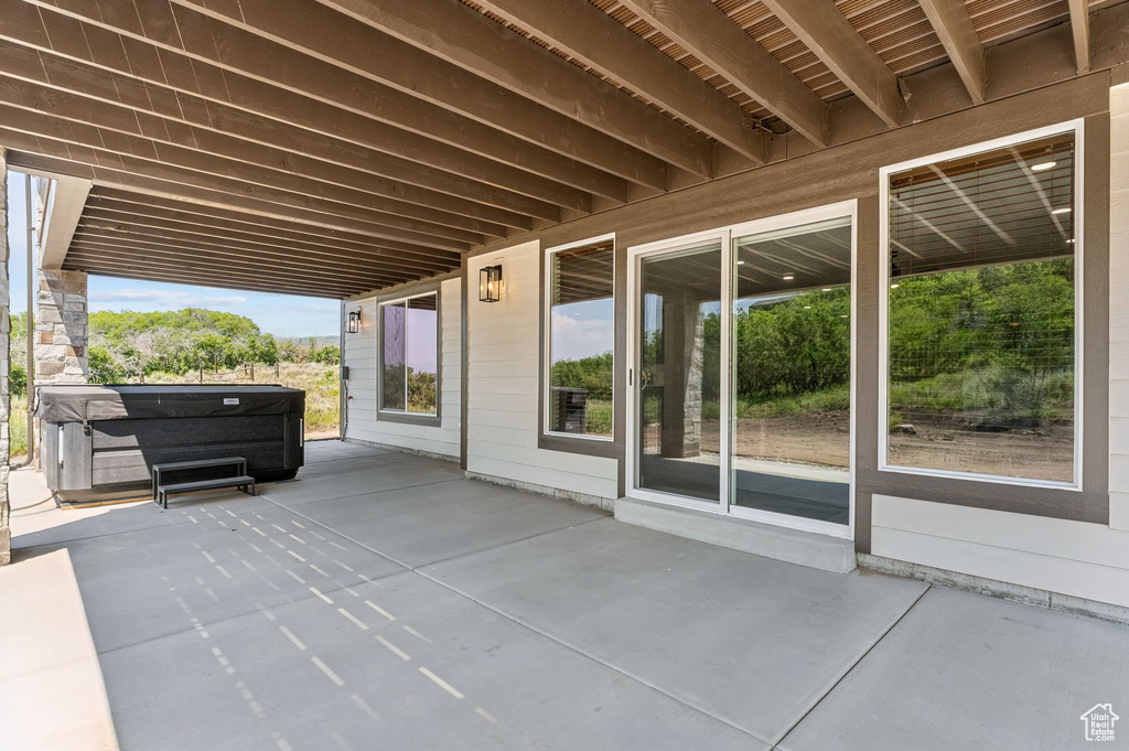 View of patio / terrace with a hot tub