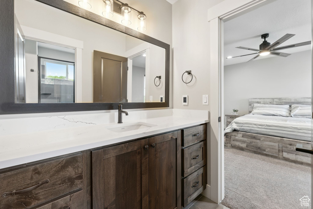 Bathroom with vanity and ceiling fan