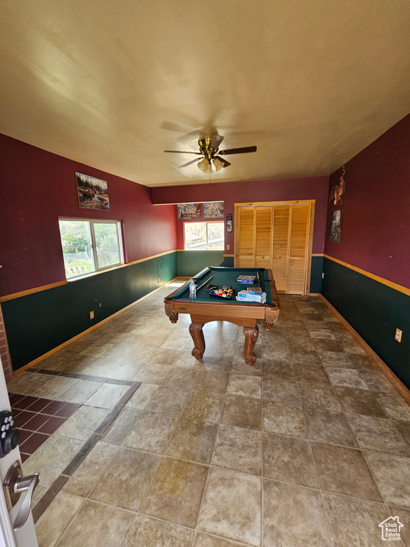 Recreation room featuring tile patterned flooring, pool table, and ceiling fan