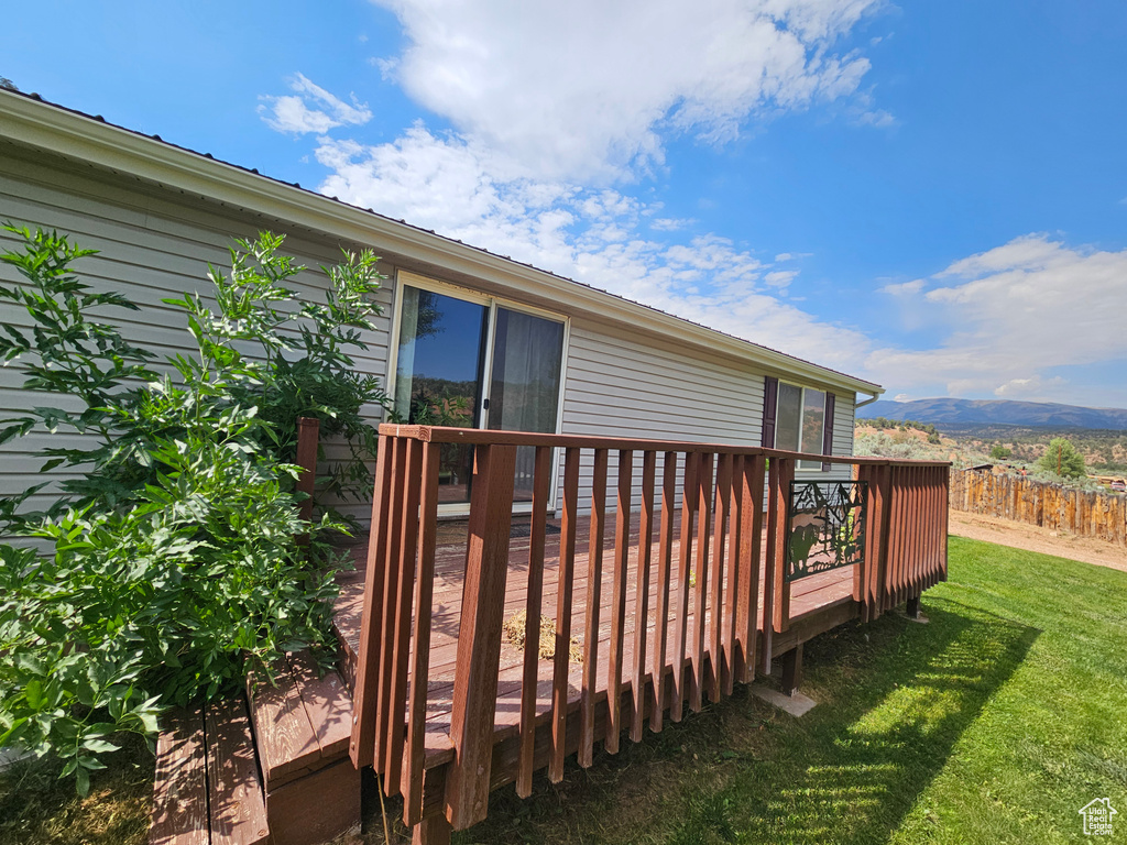 Wooden deck with a yard