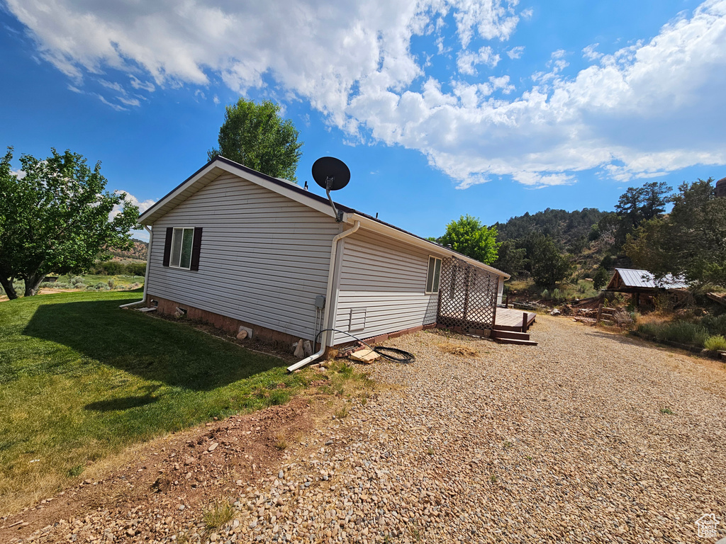 View of home\\\'s exterior with a lawn