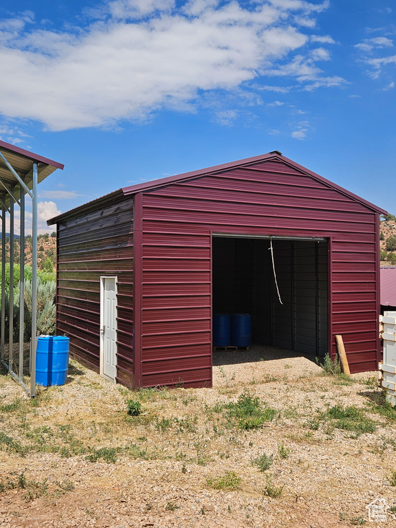 View of outdoor structure featuring a garage