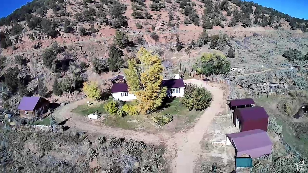 Birds eye view of property featuring a mountain view