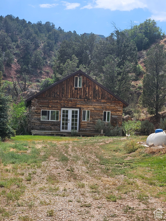 Log-style house with french doors