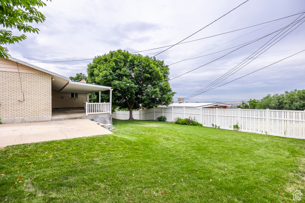 View of yard with a patio