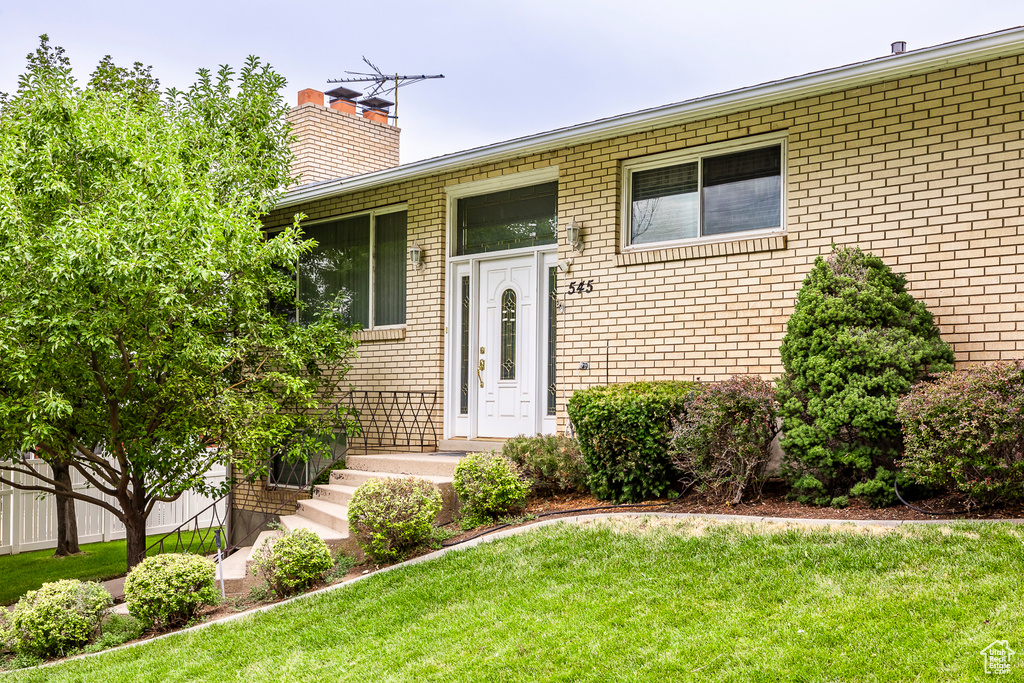 Exterior space featuring a front lawn