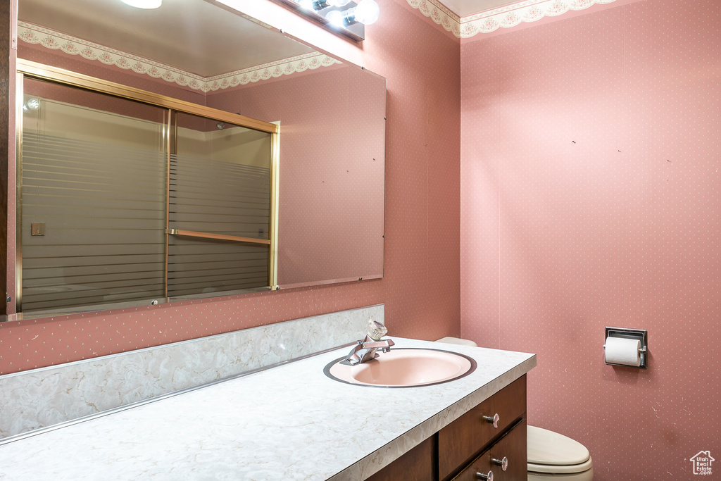 Bathroom featuring toilet and vanity