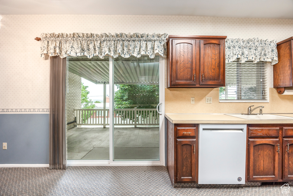 Kitchen with white dishwasher and sink