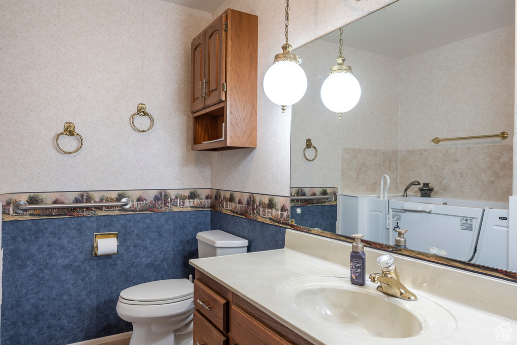 Bathroom featuring vanity and toilet