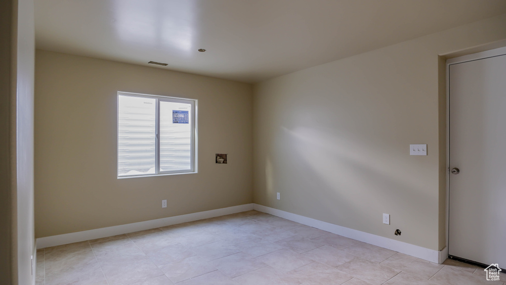 View of tiled spare room