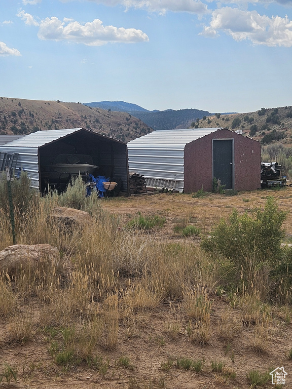 Exterior space featuring a mountain view and a carport