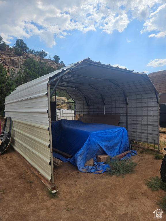 Exterior space with a carport