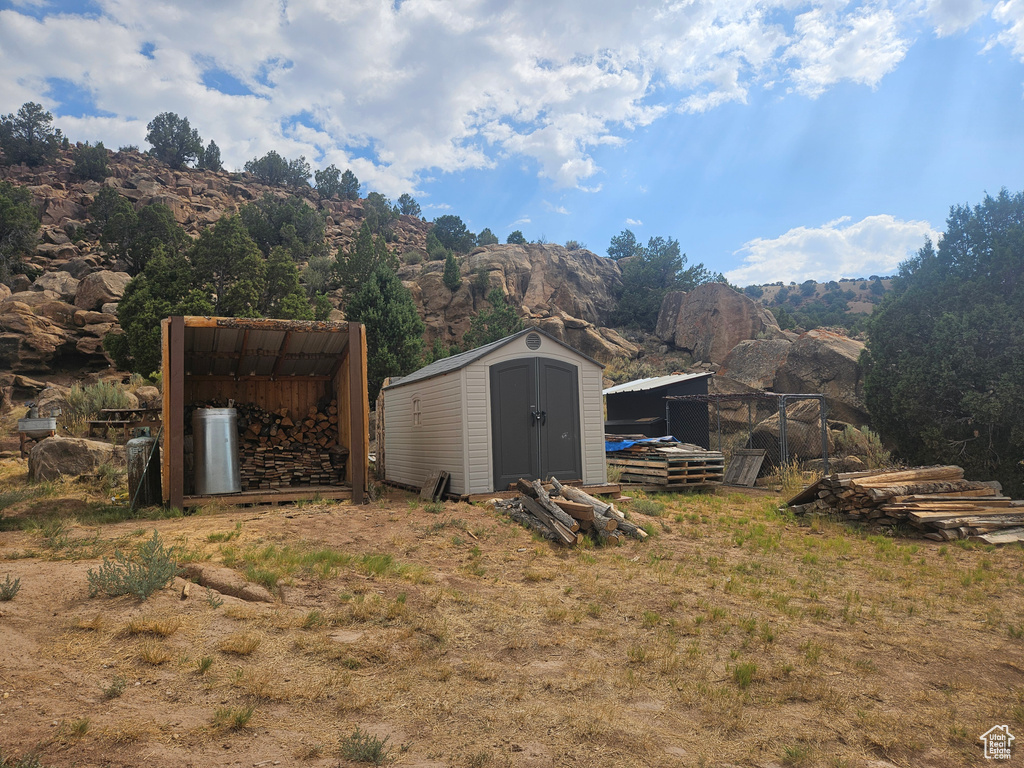 View of outbuilding with a mountain view