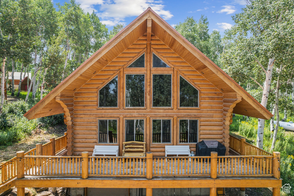 Rear view of house featuring a deck