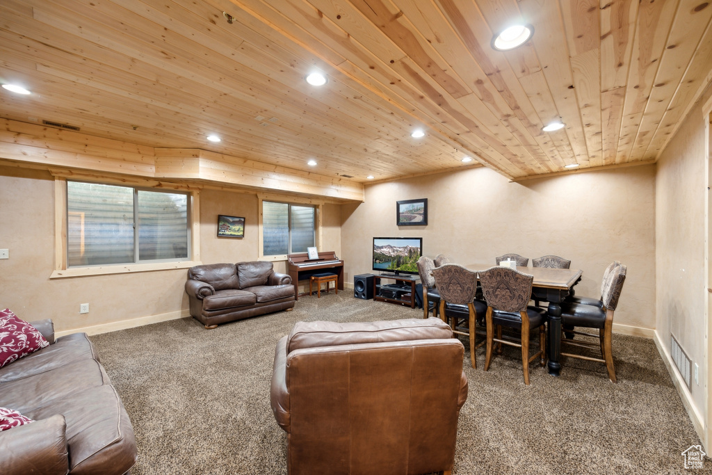 Living room featuring carpet floors and wood ceiling